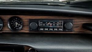 Vintage AM FM car radio representing songs remembered from the 1970s